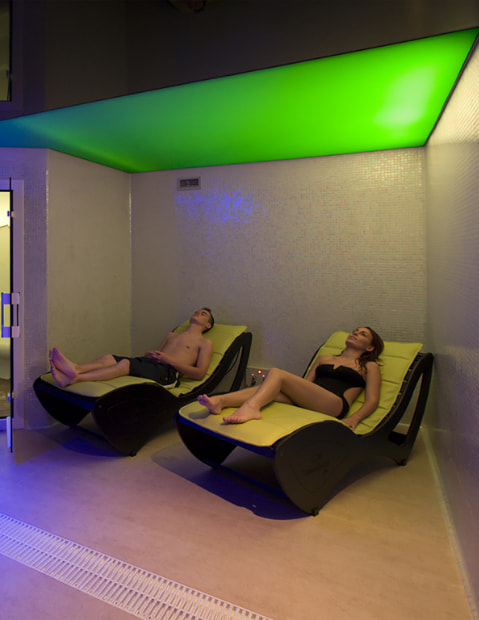 Couple lounging in the spa loungers