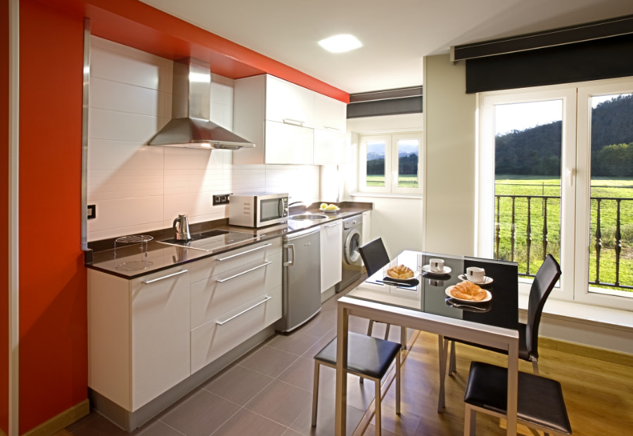 Fully equipped kitchen with dining area and outdoor views