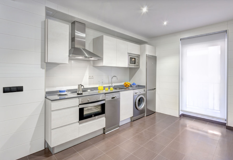 Fully fitted kitchen with fridge, oven, hob and dishwasher