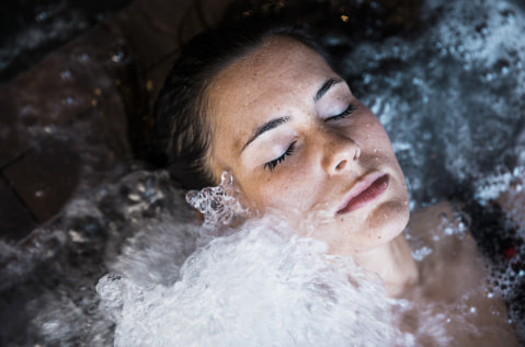 Woman relaxing in the spa pool