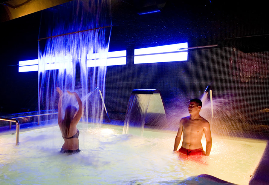 Couple in the hotel spa water circuit