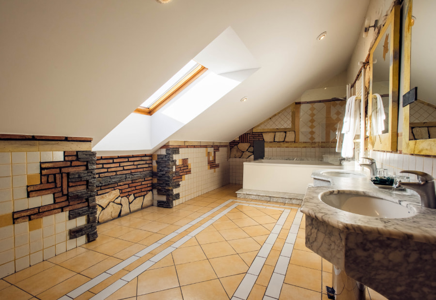 Fully fitted attic bathroom with bathtub